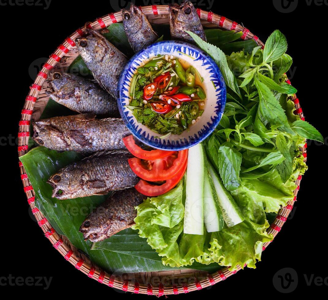 Vietnamese Pa pinh top fried fish with vegetable photo