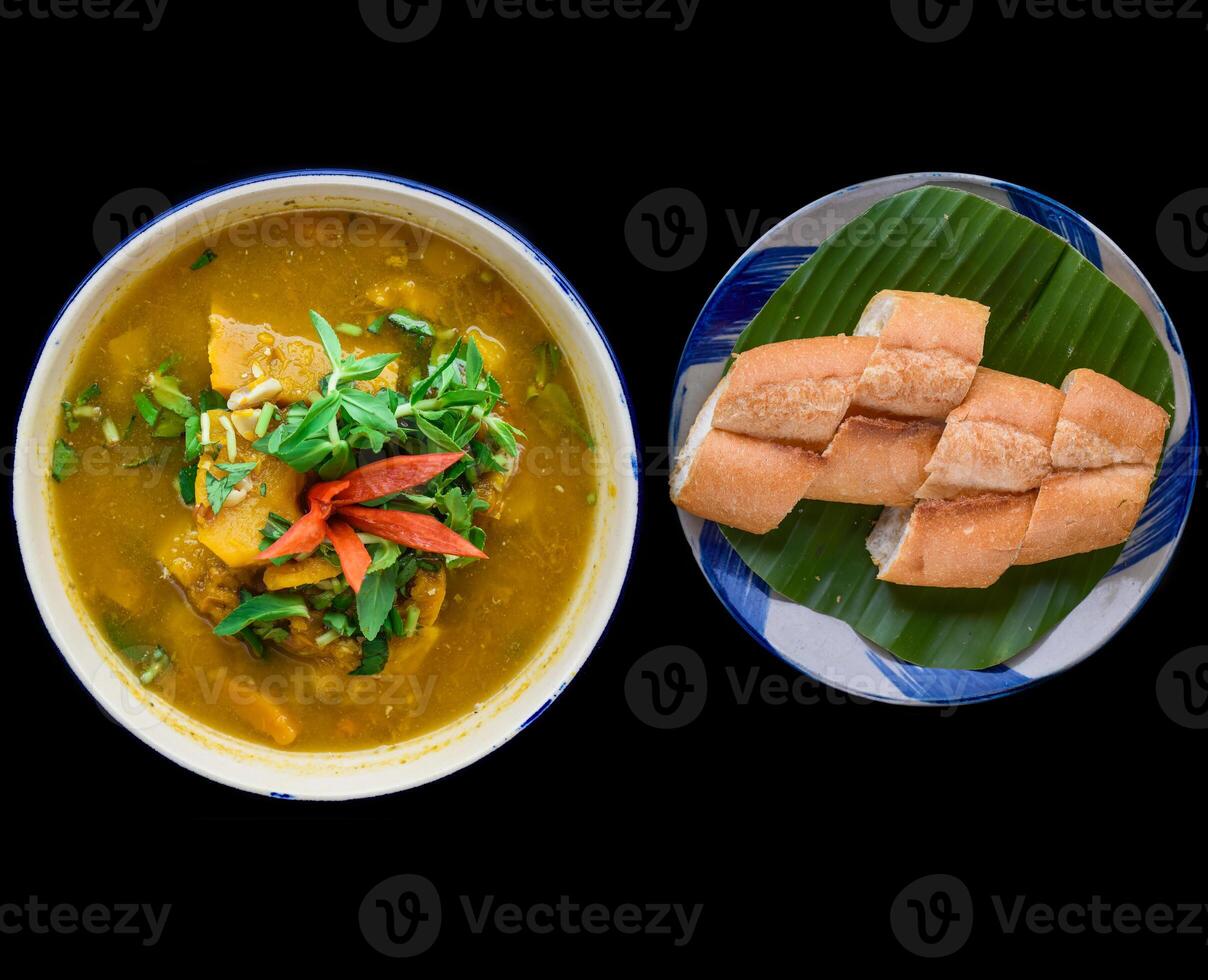 Vietnamese pumpkin Soup on a black background photo