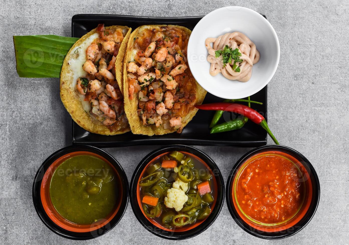 La Viga tacos with shrimps and mexican sauces photo