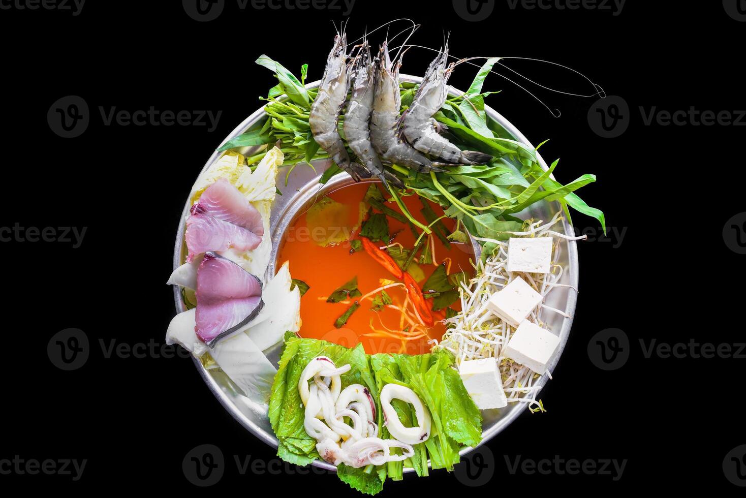 Korean hot pot with raw seafood on the black background photo