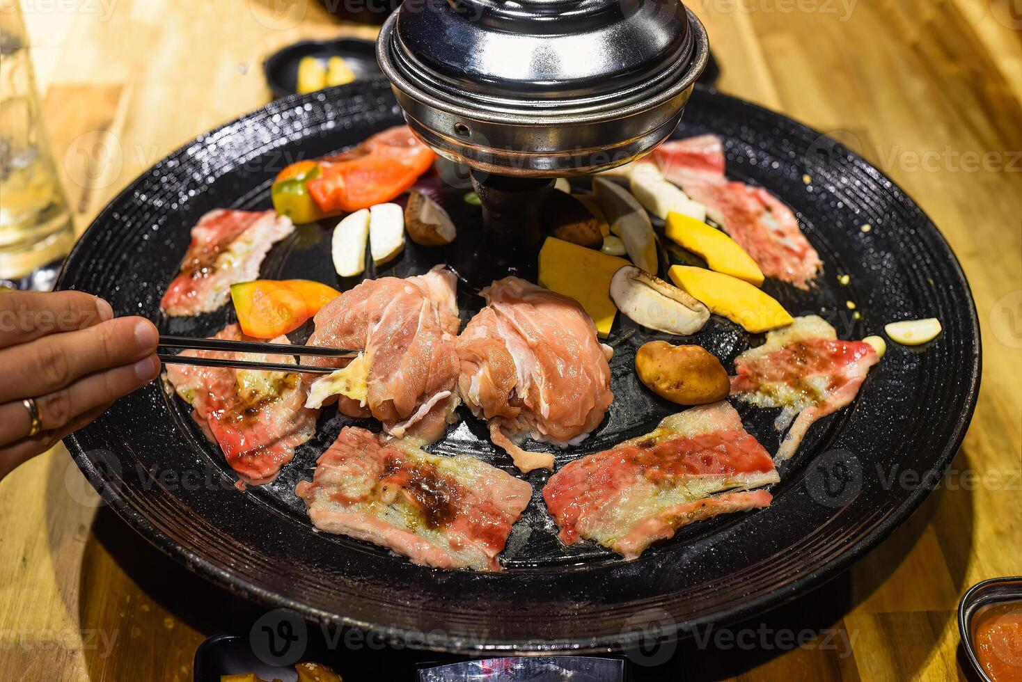 Traditional korean bbq with chicken beef and vegetables photo