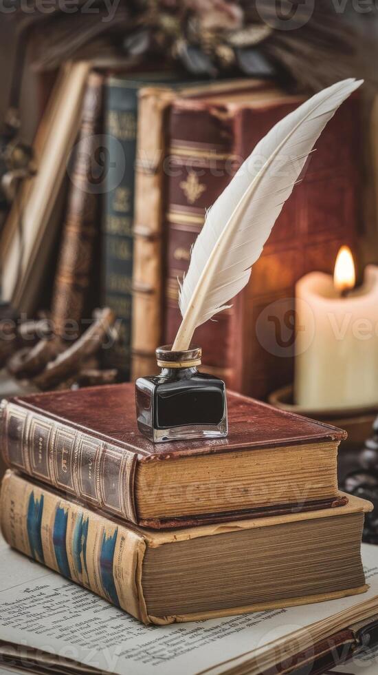 An old book with a quill and ink on top of an old book photo
