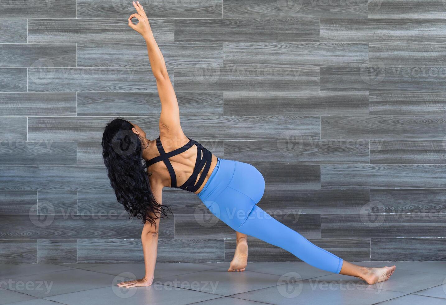side plank pose or vasisthasana yoga with woman photo