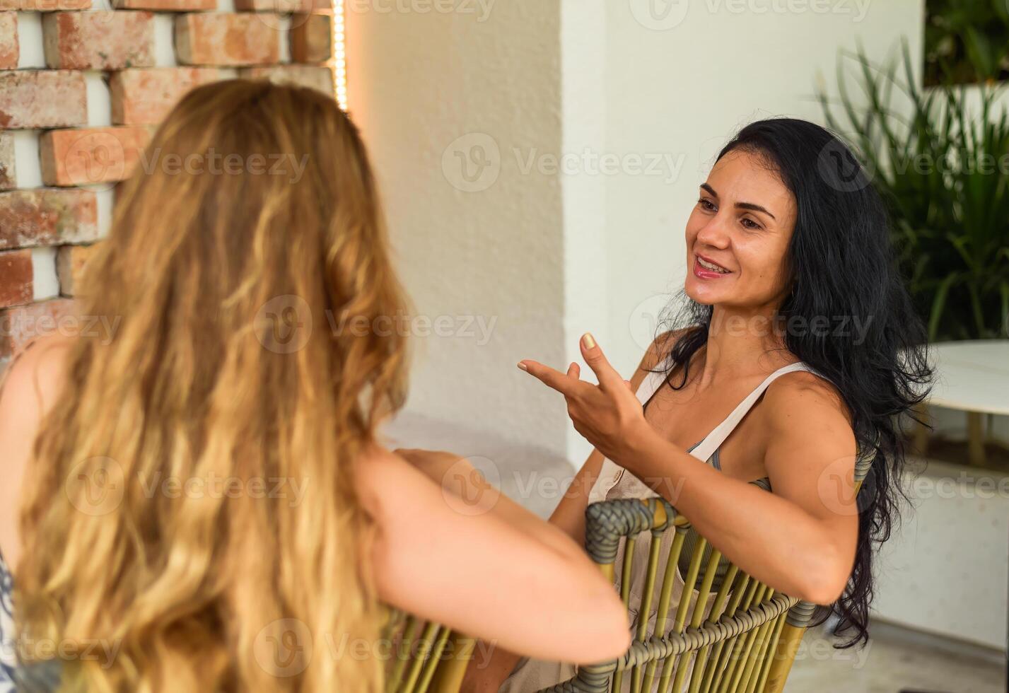 Russian blonde woman talking with her best friend.. photo