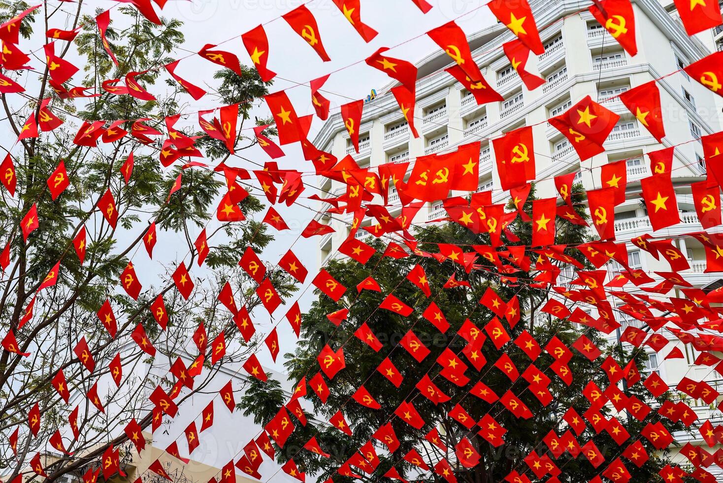 Vietnamese flags and communism flags in Nha Trang, Vietnam photo