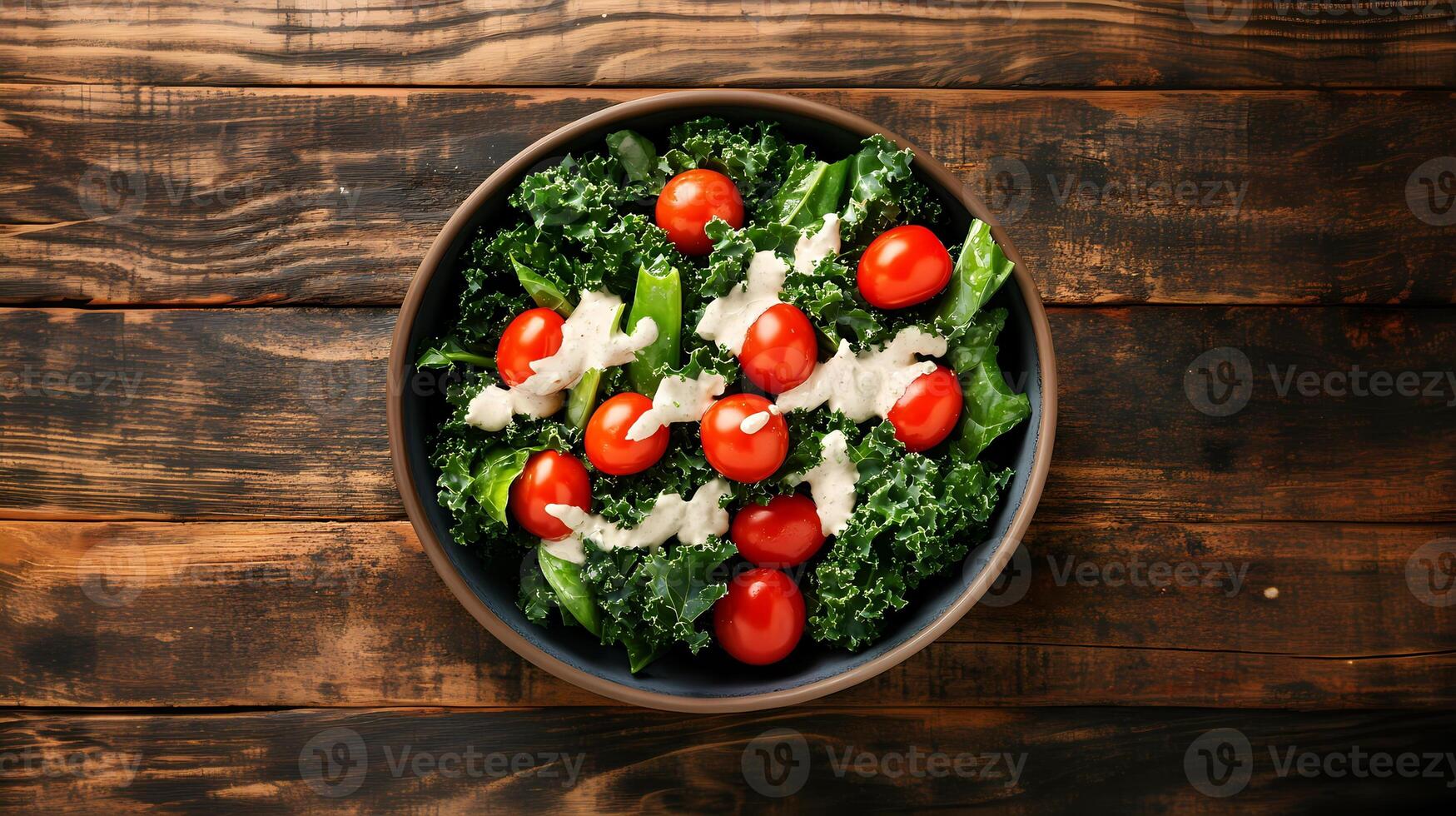 Fresh kale and cherry tomato salad with dressing photo