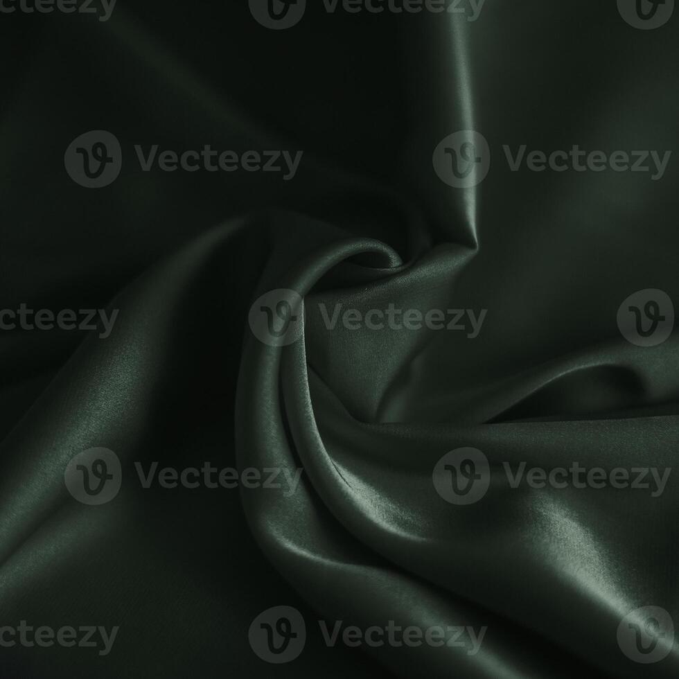 photo of green dark silk fabric template of fabric roll of fabric