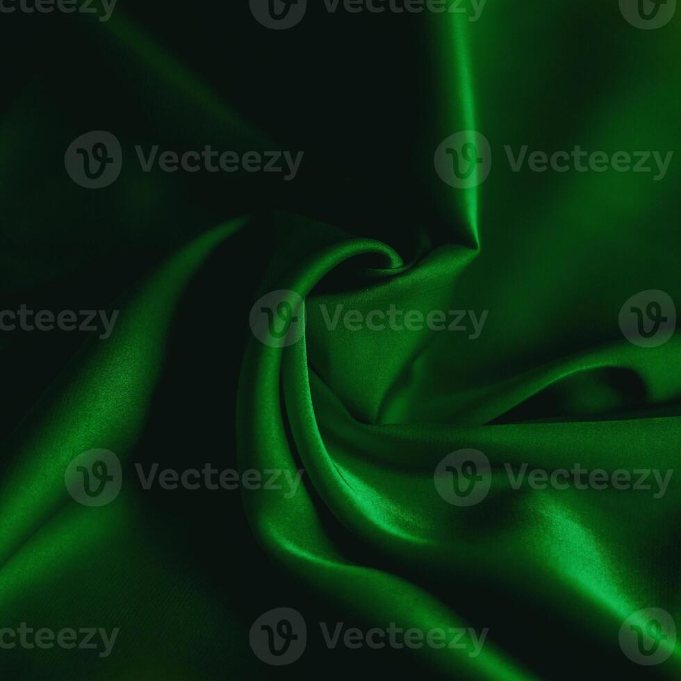 photo of emerald silk fabric template of fabric roll of fabric