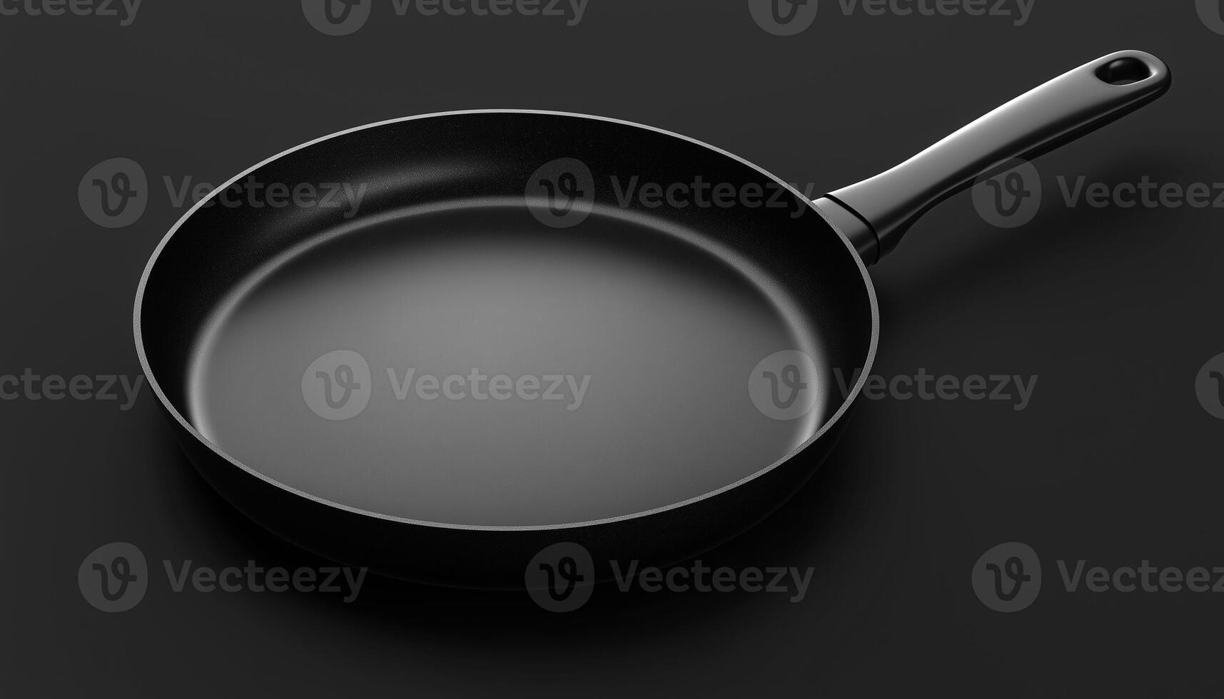 Empty iron black frying pan for cooking dishware on dark background photo