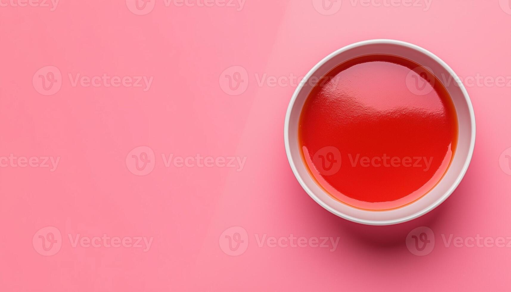 Tomato sauce red cream on bowl copy space pink background photo