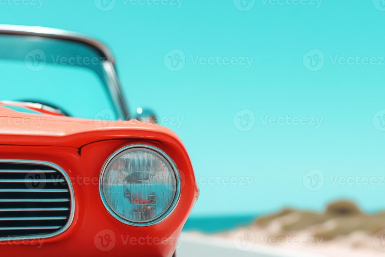 Vibrant red car detail against a bright blue sky evokes summer vibes and open road adventures photo