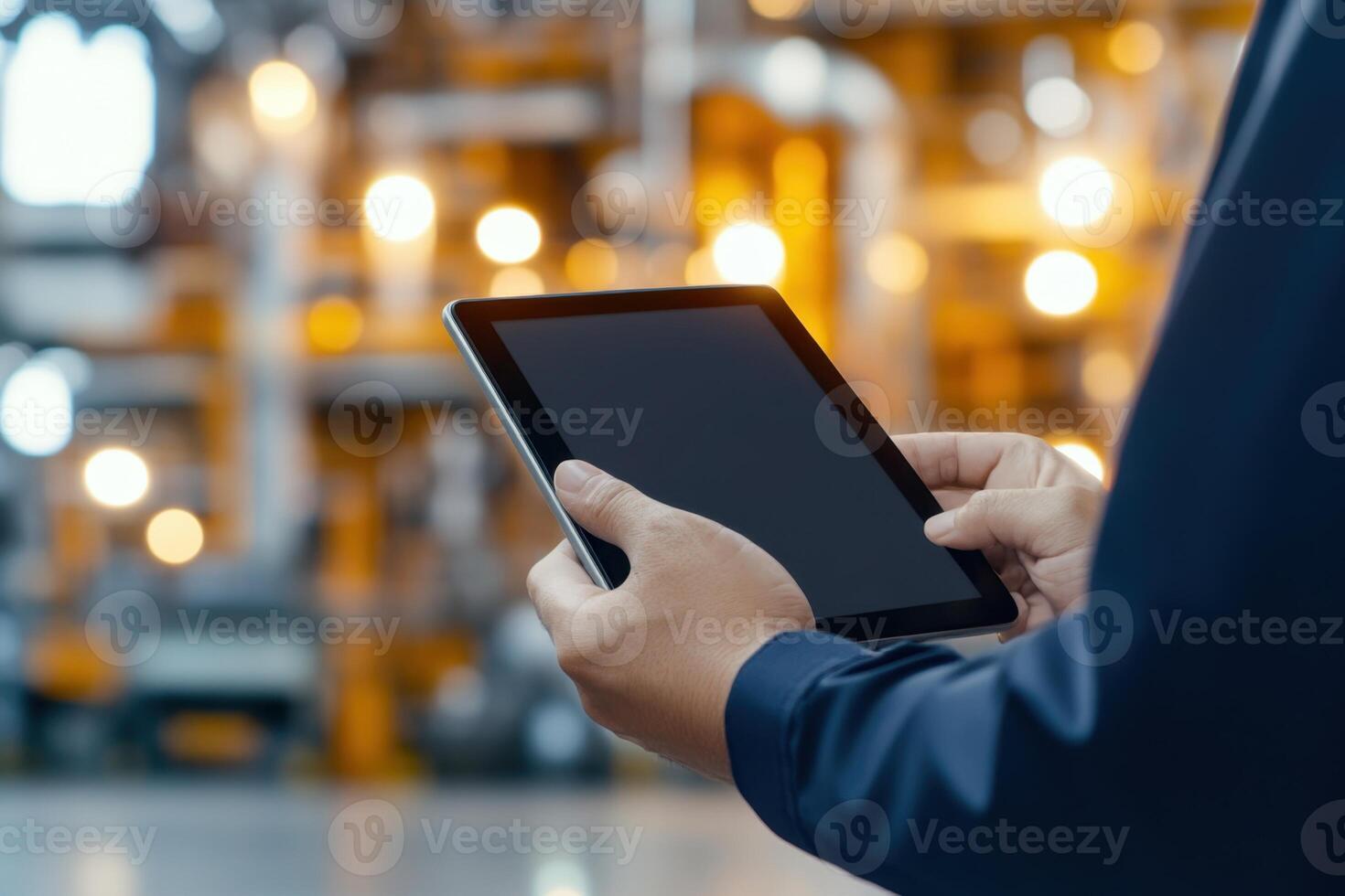 Technician using a tablet for industrial maintenance, data analysis, and process optimization photo