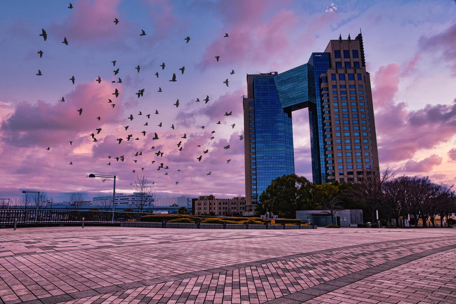 A dusk of cloud reflecting an impressive building cloudy wide shot photo
