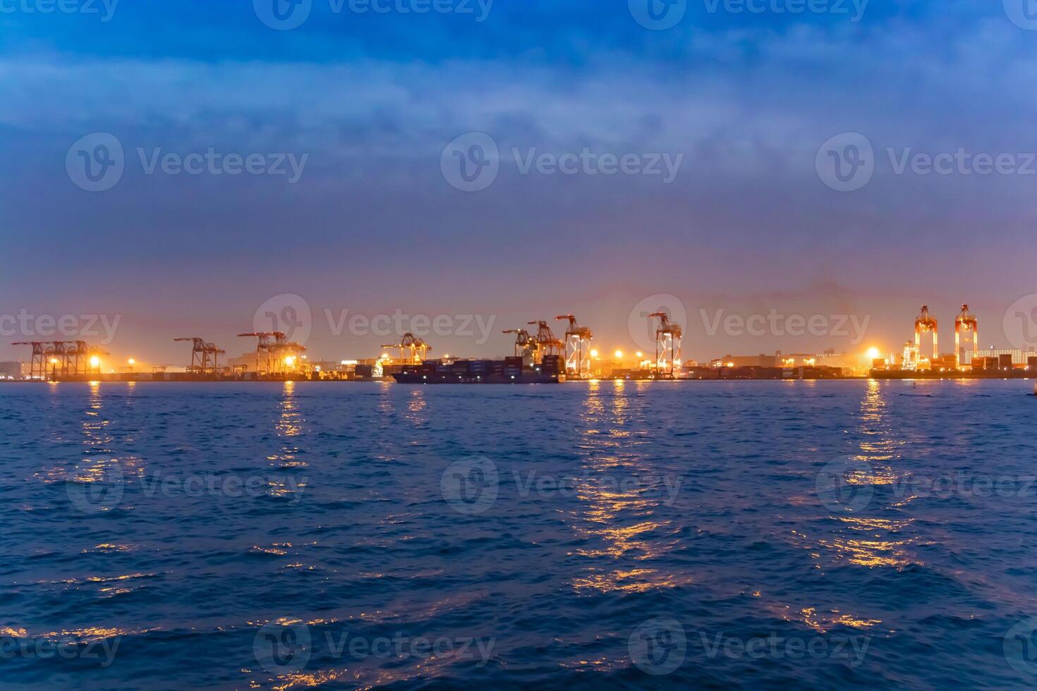 A dusk cityscape near the container port in Tokyo photo