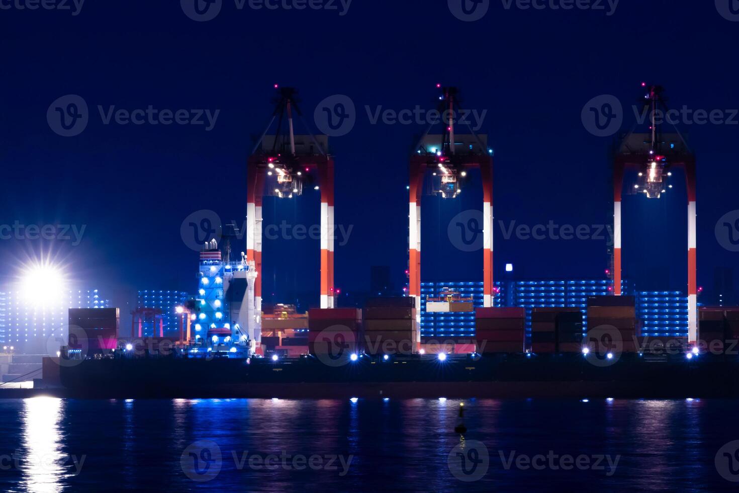 Night cranes near the container port in Tokyo long shot photo