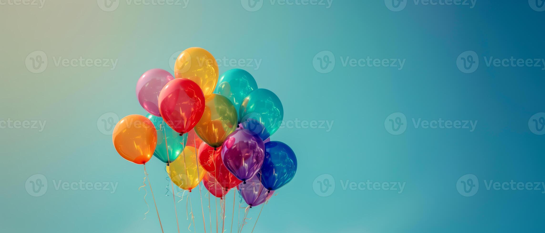 Floating rainbow color balloons on clear blue sky background, pride month celebration concept photo