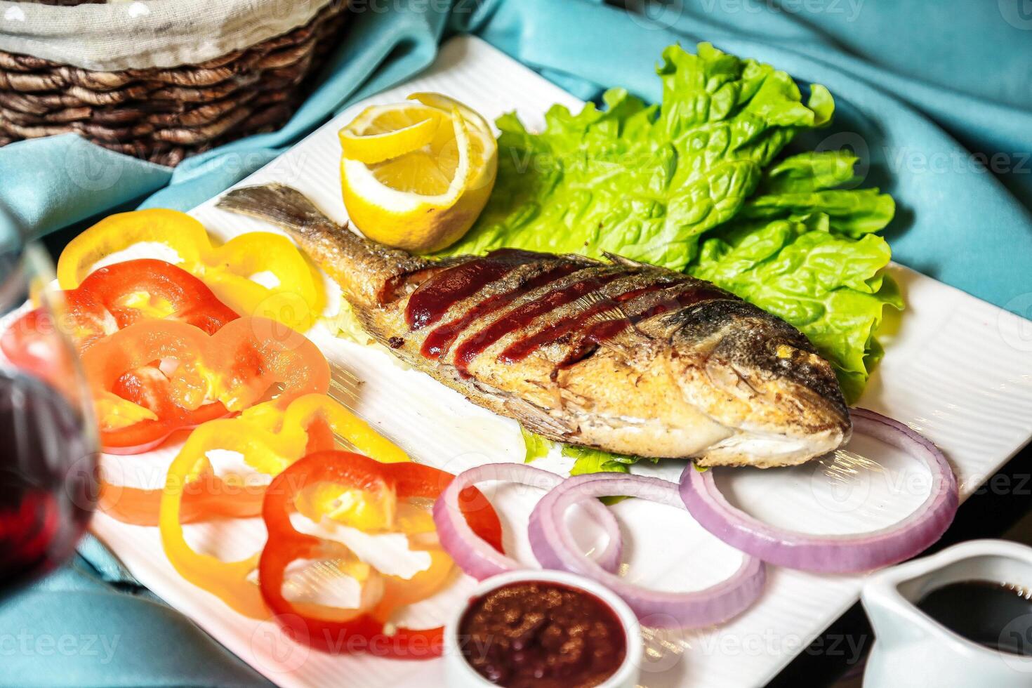 White Plate With Freshly Grilled Fish and Assorted Vegetables photo
