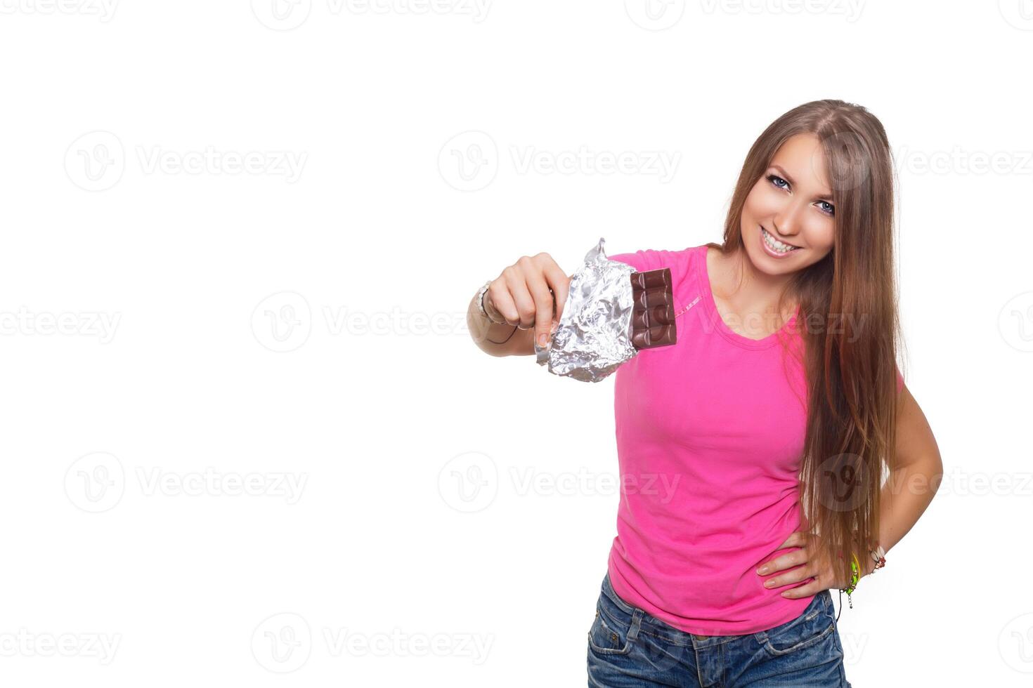 Beauty model woman eating dark chocolate. Beautiful Surprised young woman takes chocolate sweets, smiling and having fun. Funny girl, professional make up and bow hairstyle, Isolatet on white. photo
