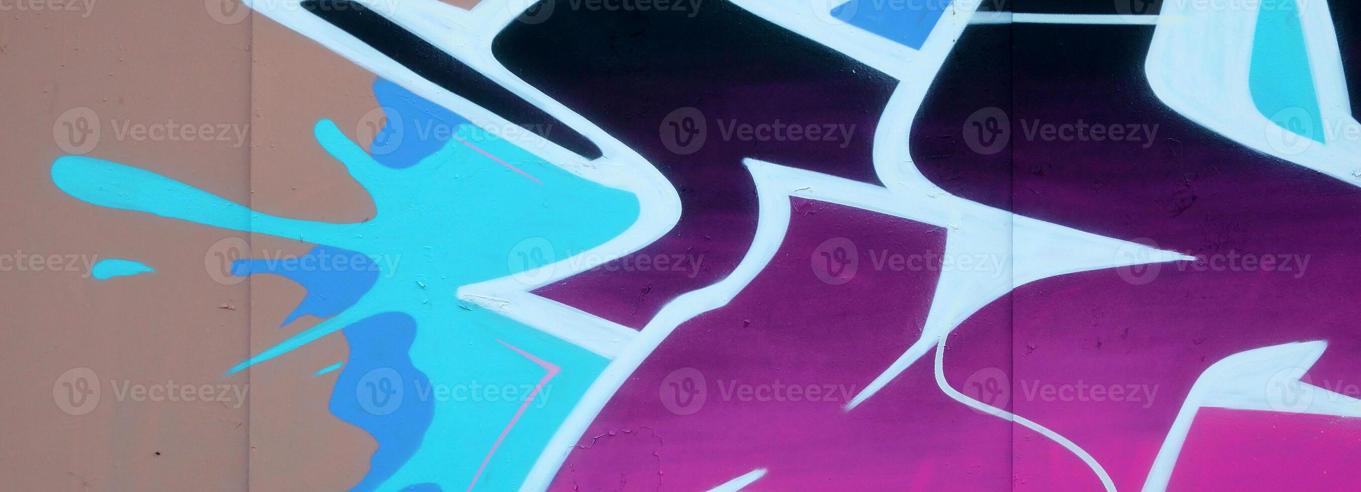 Colorful background of graffiti painting artwork with bright aerosol outlines on wall. Old school street art piece made with aerosol spray paint cans. Contemporary youth culture photo