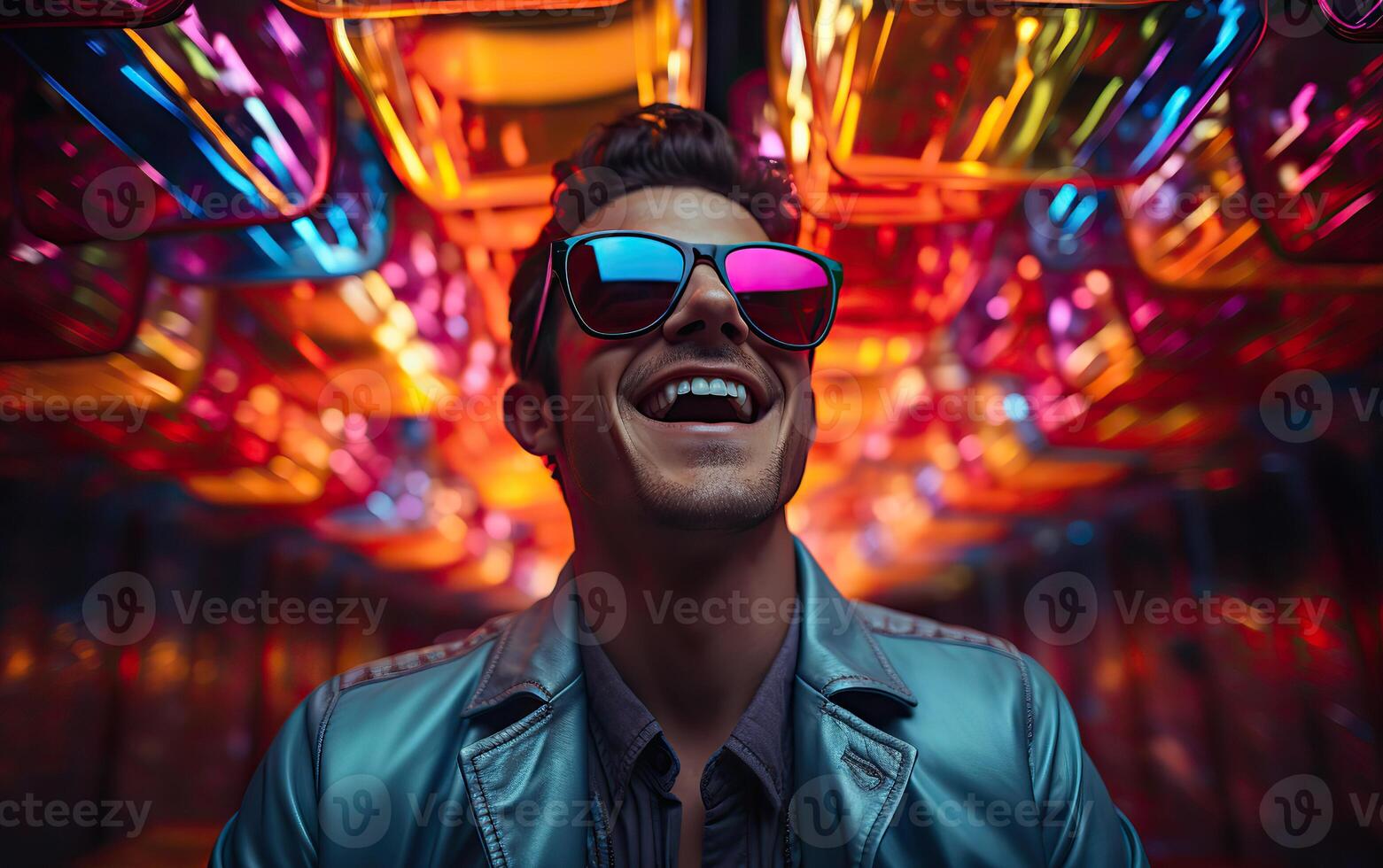 Handsome man in colorful sunglasses with smile attractive portrait in neon tunnel background scene photo