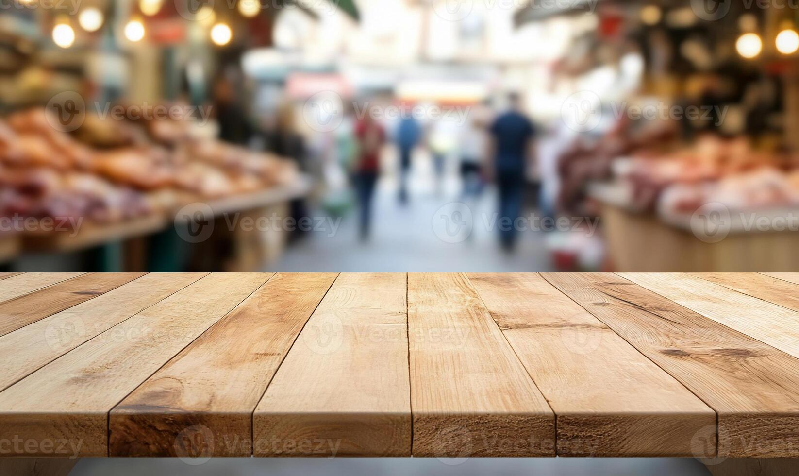 A wooden table in a bustling market scene with blurred vendors. photo