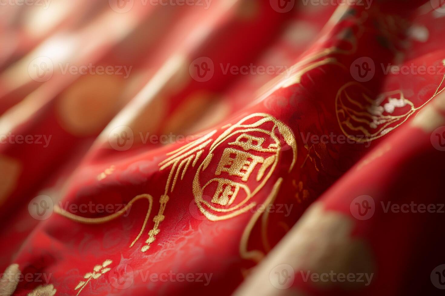 A close-up of luxurious red fabric with intricate golden patterns. photo