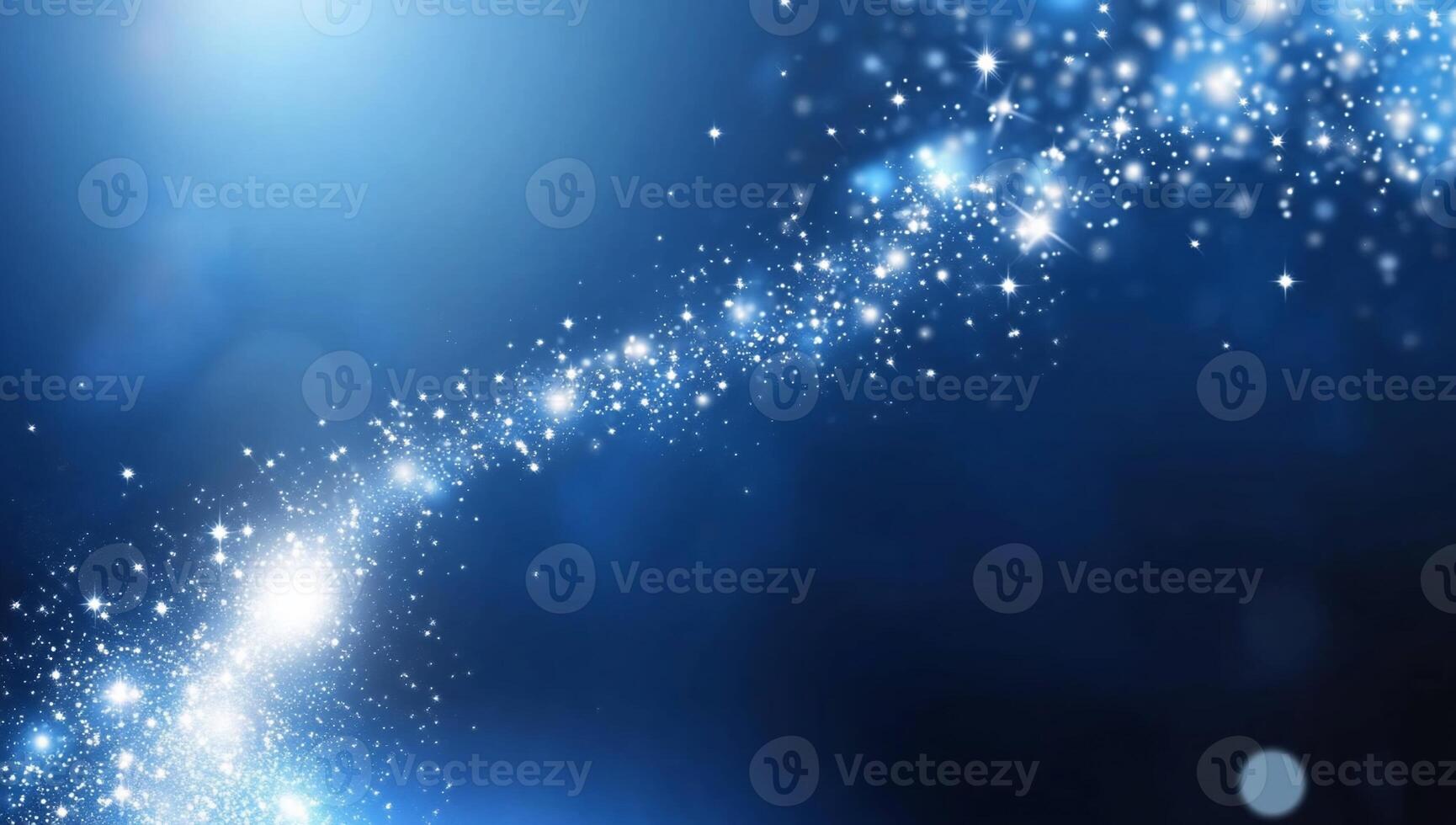 A cosmic scene featuring sparkling stars against a blue background. photo