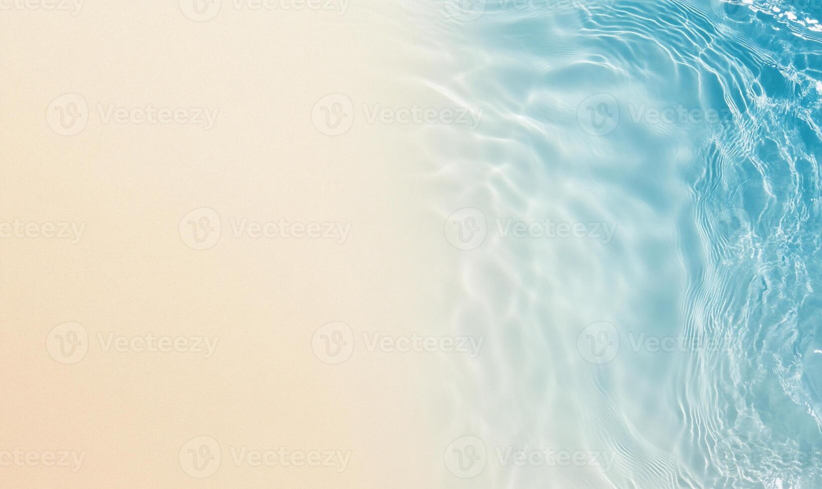 A serene blend of sandy beach and clear blue water. photo