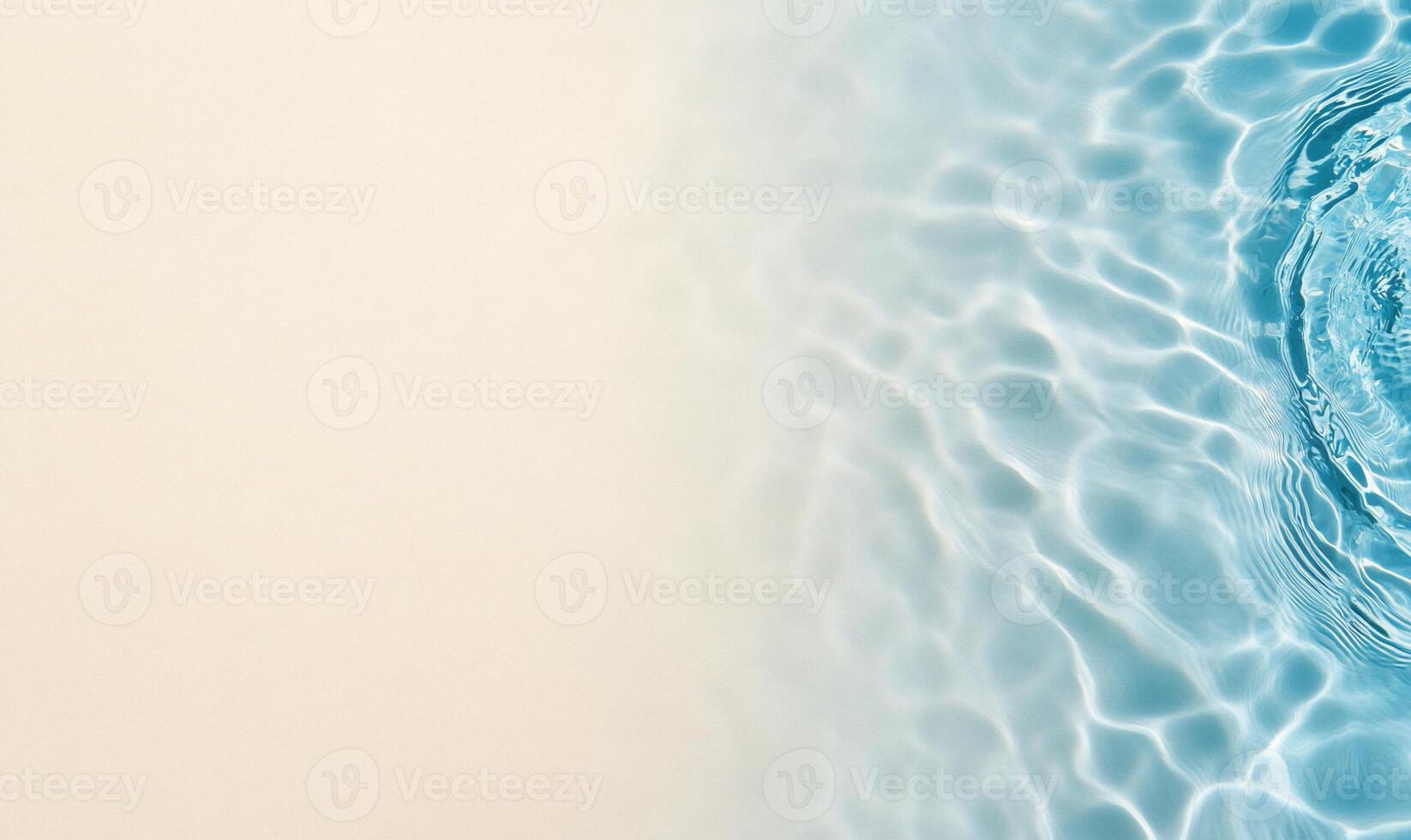 A serene water surface with gentle ripples against a light background. photo