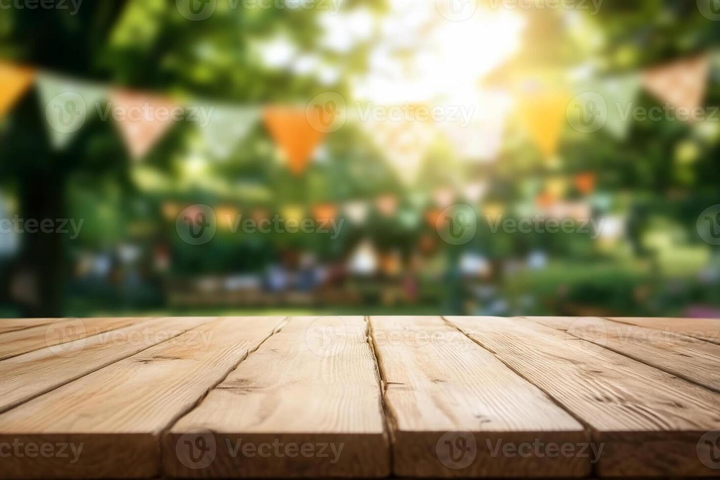 A wooden table in a blurred outdoor setting with festive decorations. photo