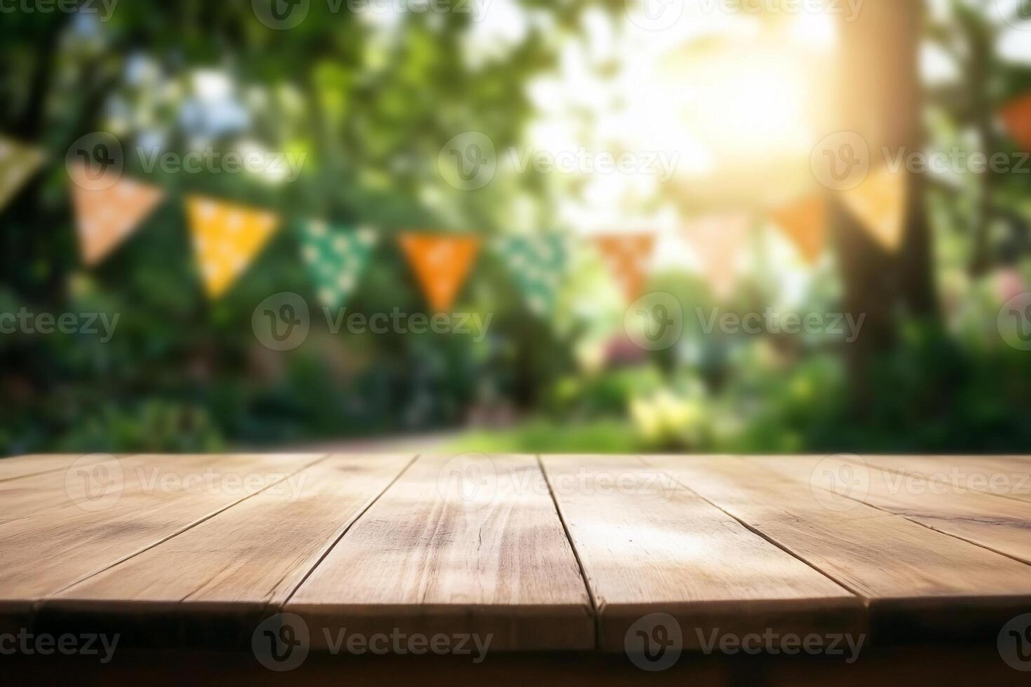 A wooden table in a garden setting with festive bunting. photo