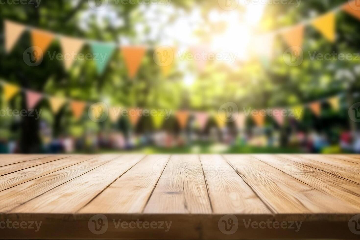 A wooden table in a festive outdoor setting with colorful bunting. photo