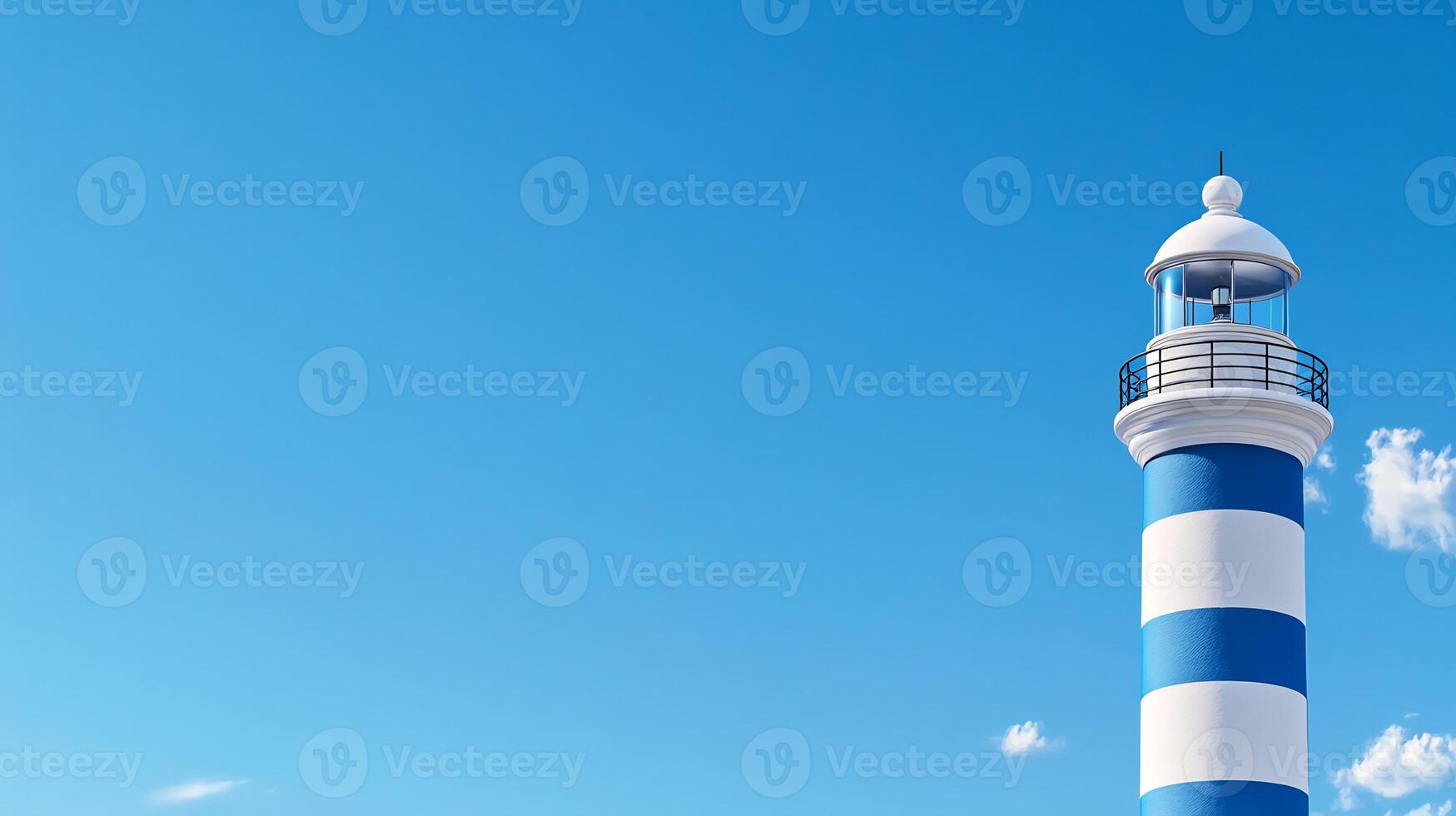 A blue and white lighthouse with a blue sky background photo