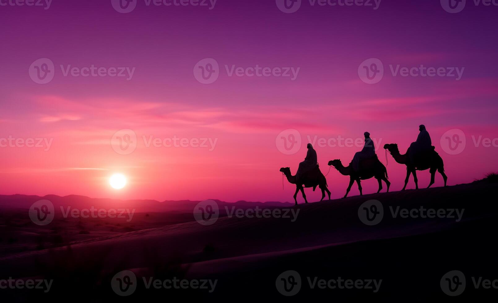 Three wise men on camels in the desert at sunset photo