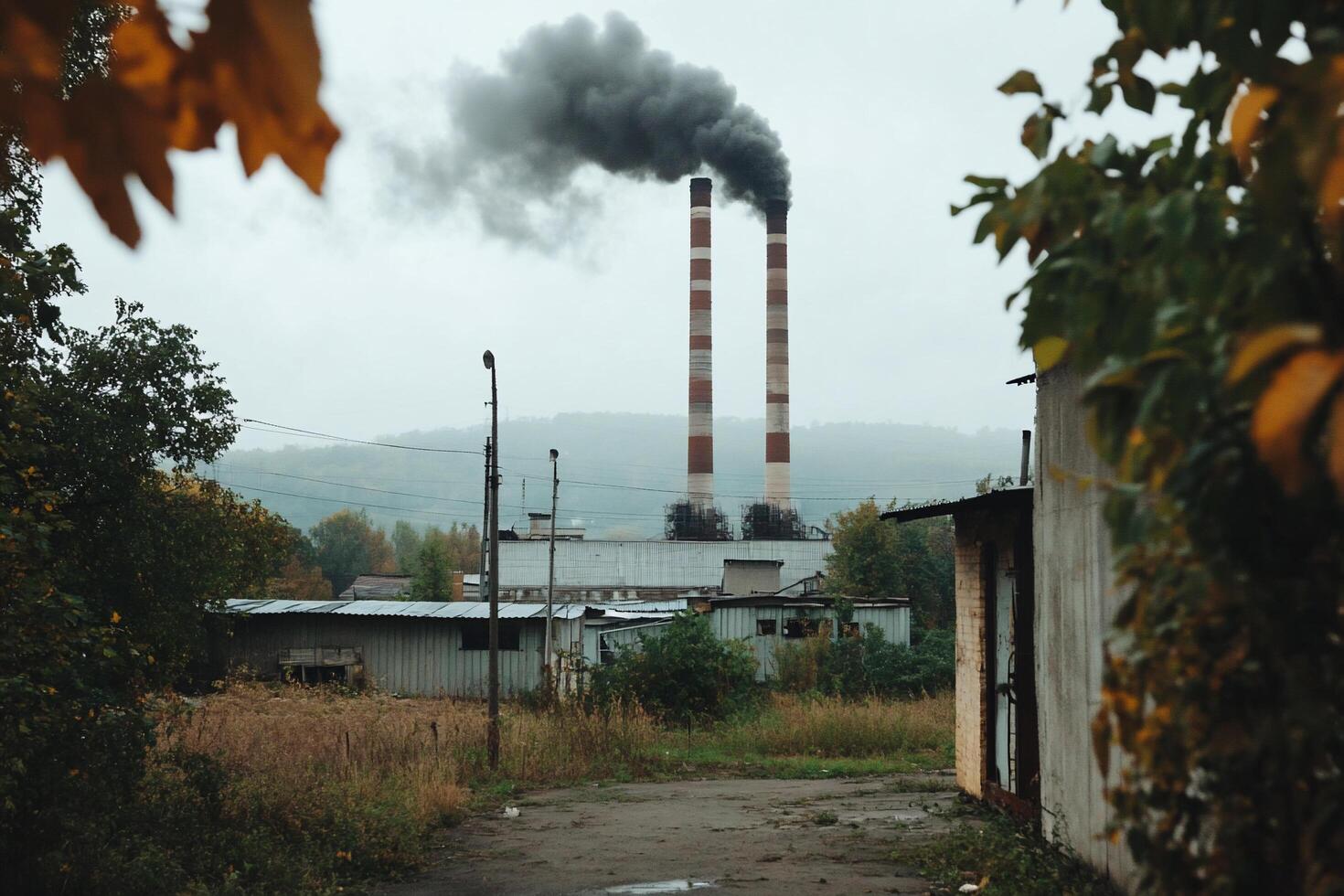 A factory with smoke coming out of the chimney photo