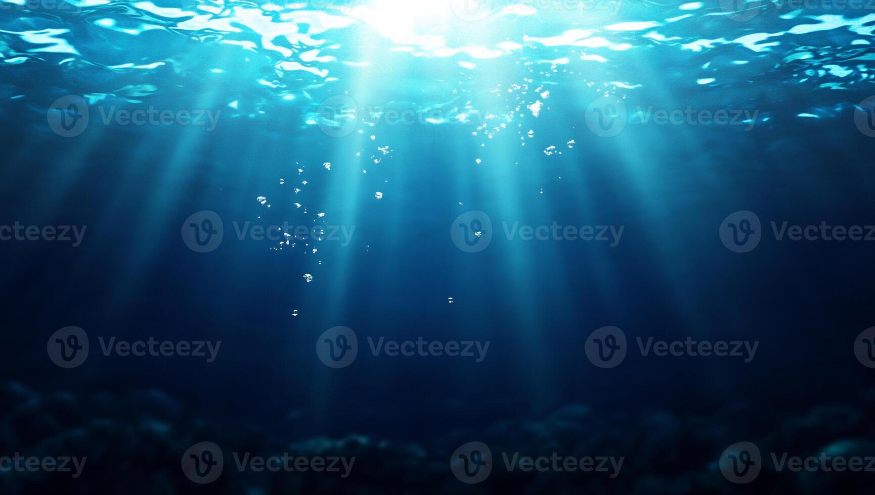 Underwater scene with sunlight rays illuminating the ocean depths. photo