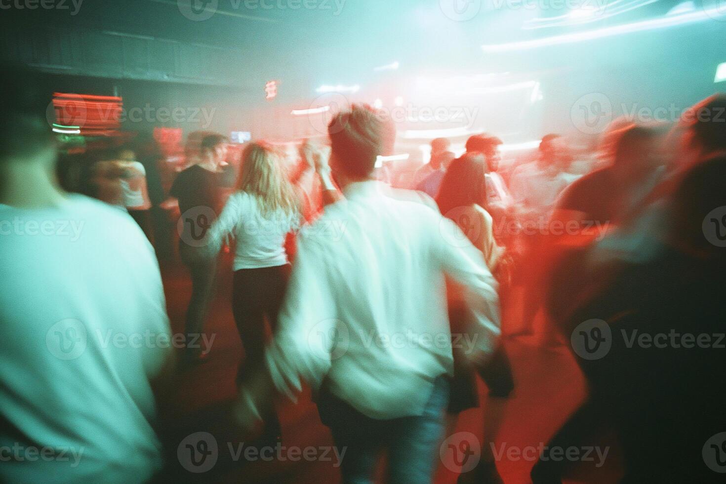 A lively dance scene with people enjoying a vibrant atmosphere. photo