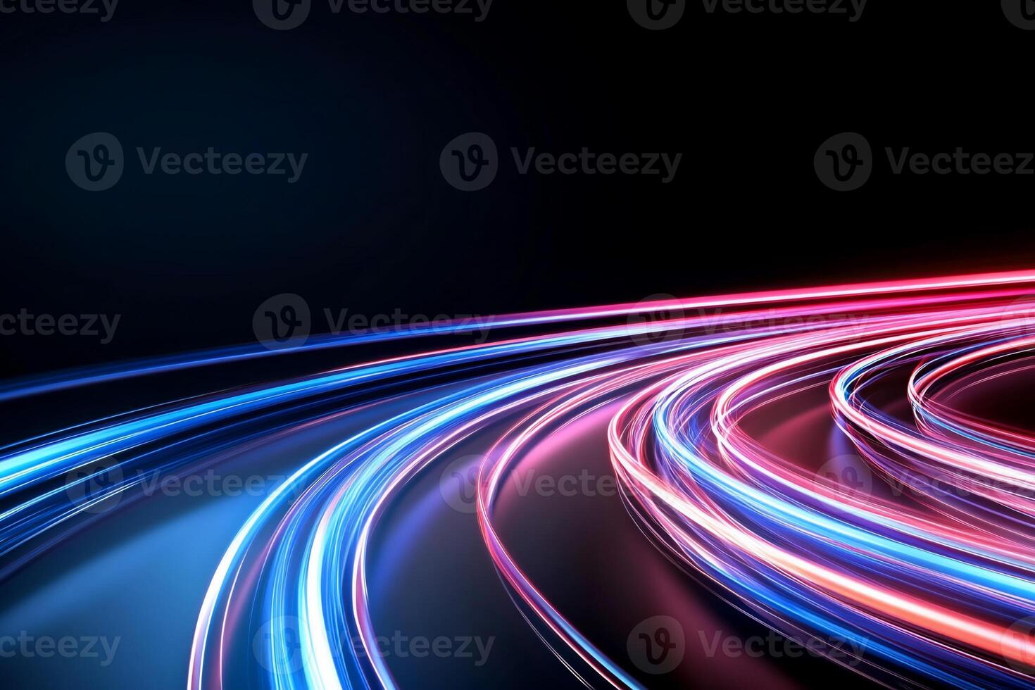 Abstract light trails in vibrant colors on a dark background. photo