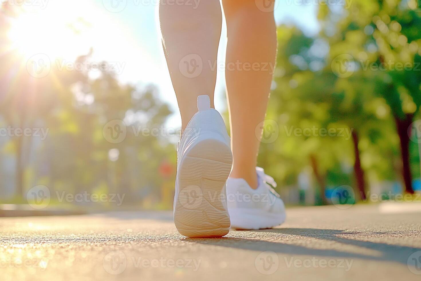 A person walking on a road with their shoes on photo