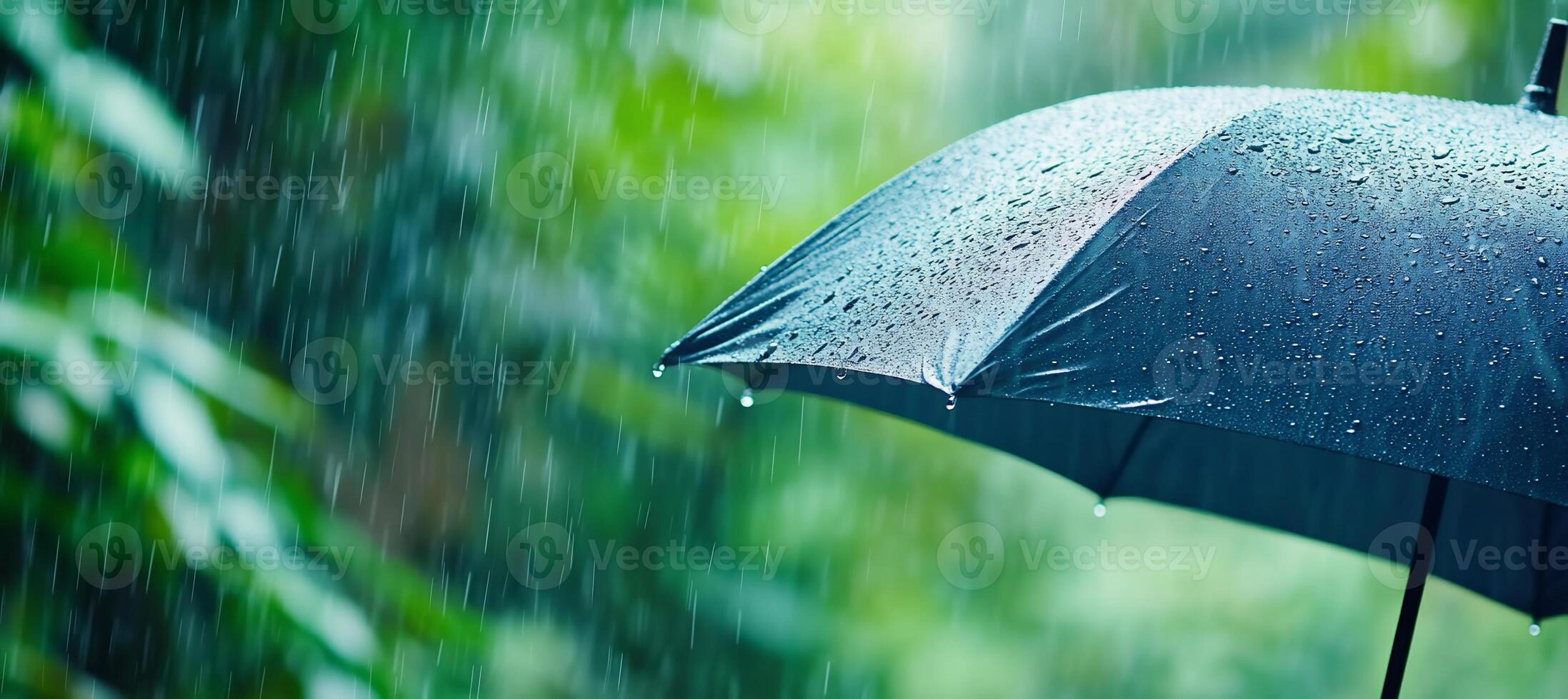 An umbrella is open in the rain photo