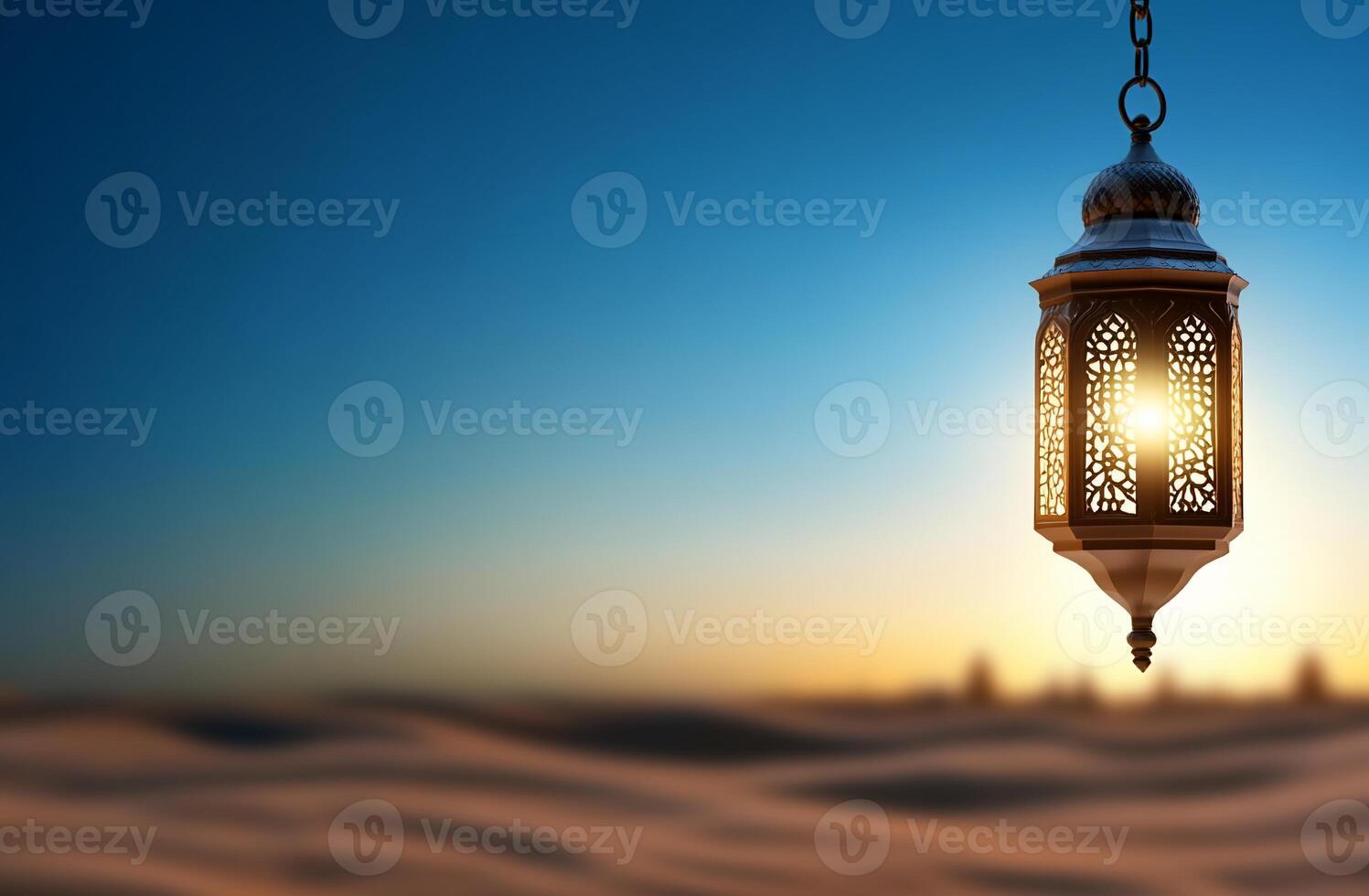 A decorative lantern casting light over a serene desert landscape. photo
