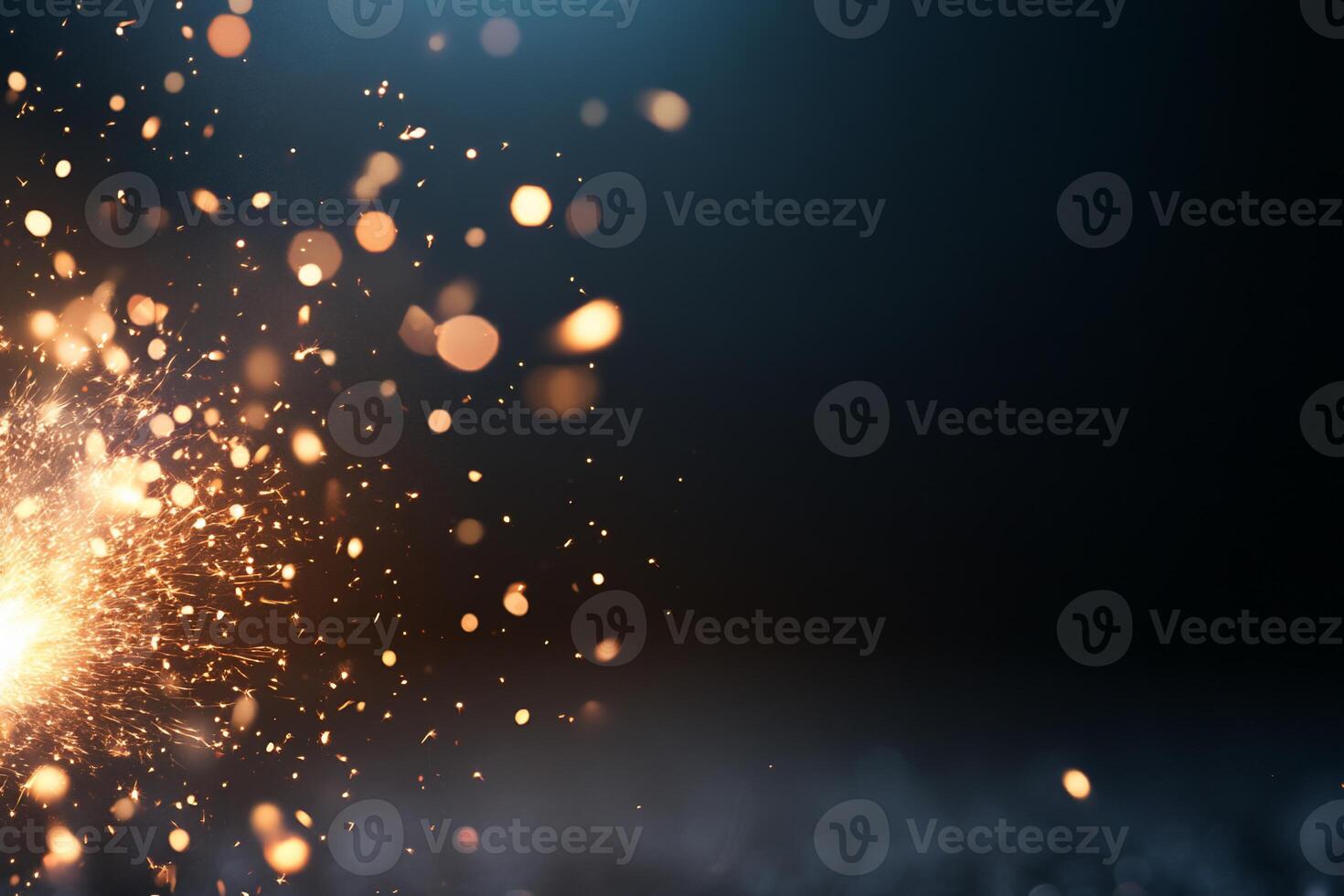 A burst of sparks and light against a dark background. photo