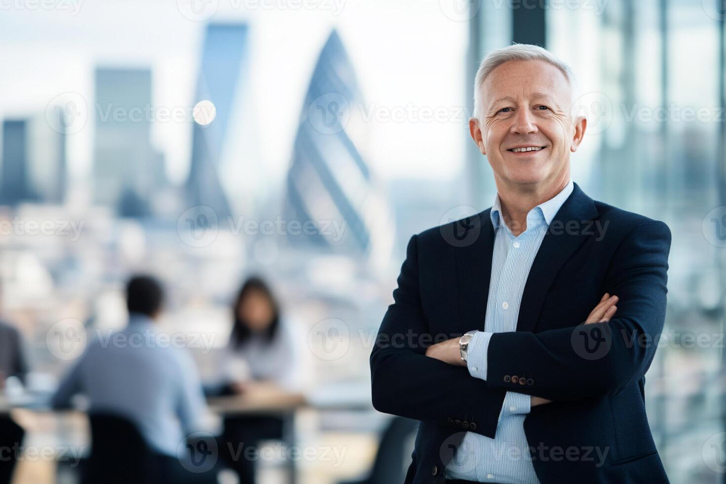 A confident businessman poses with a city skyline in the background. photo