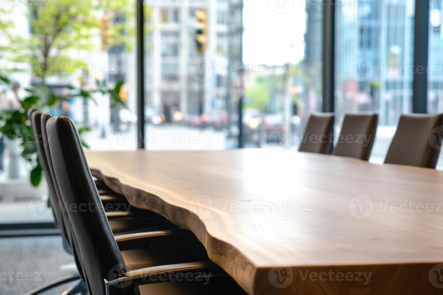 A modern conference room with a wooden table and leather chairs. photo