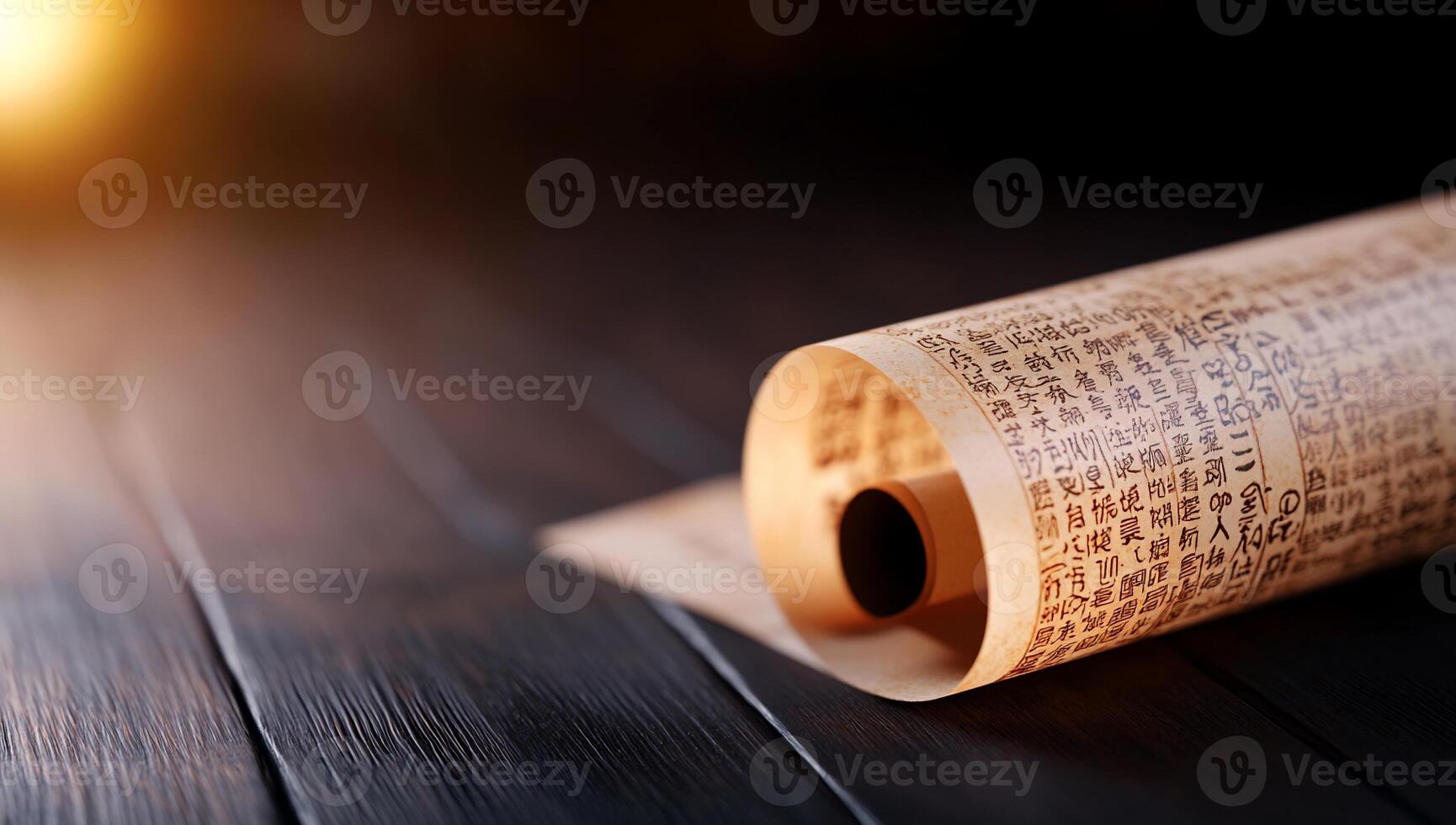 A partially unrolled scroll with text, resting on a wooden surface. photo