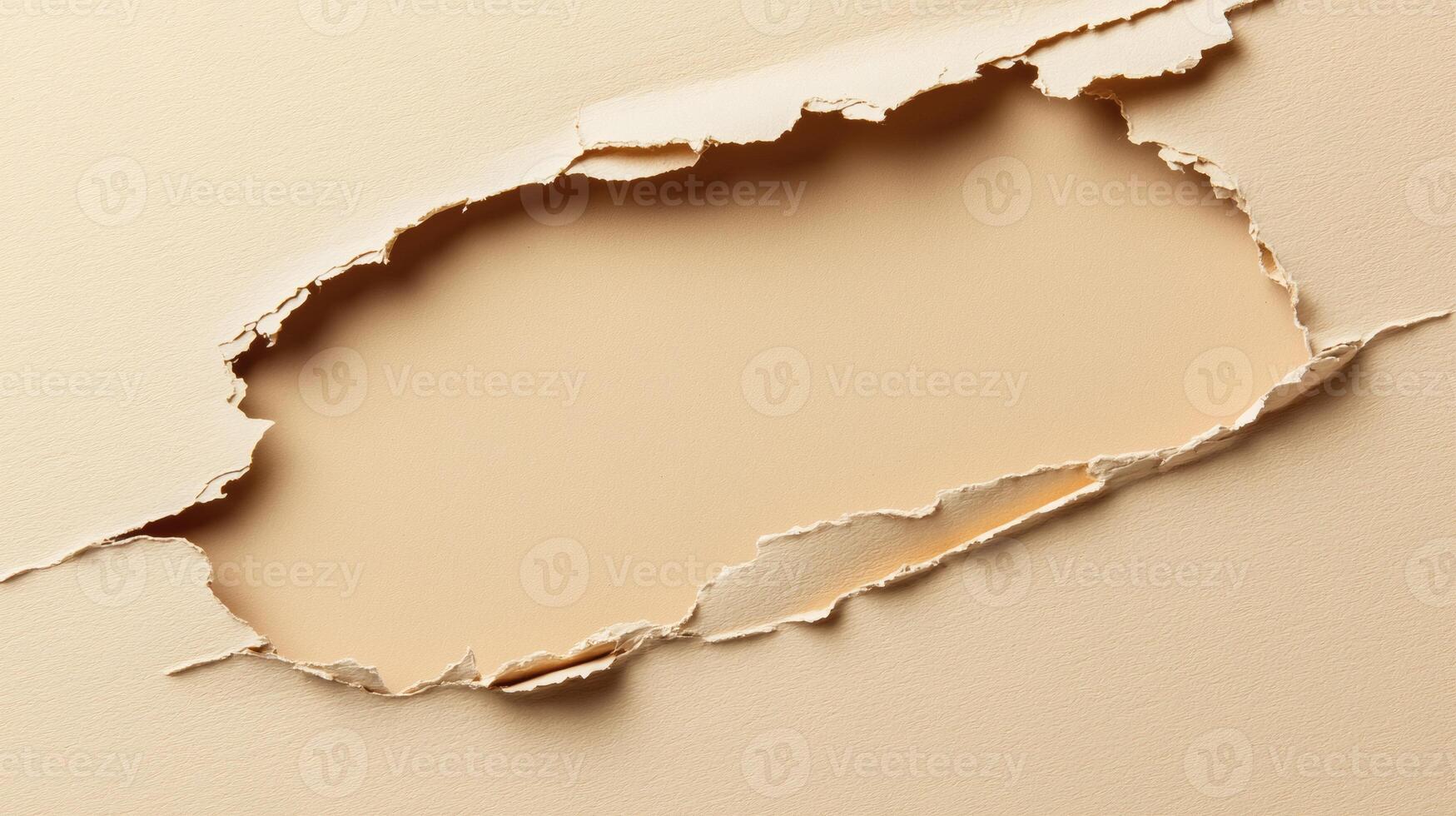 Torn Beige Paper Revealing a Blank Background with Ragged Edges photo