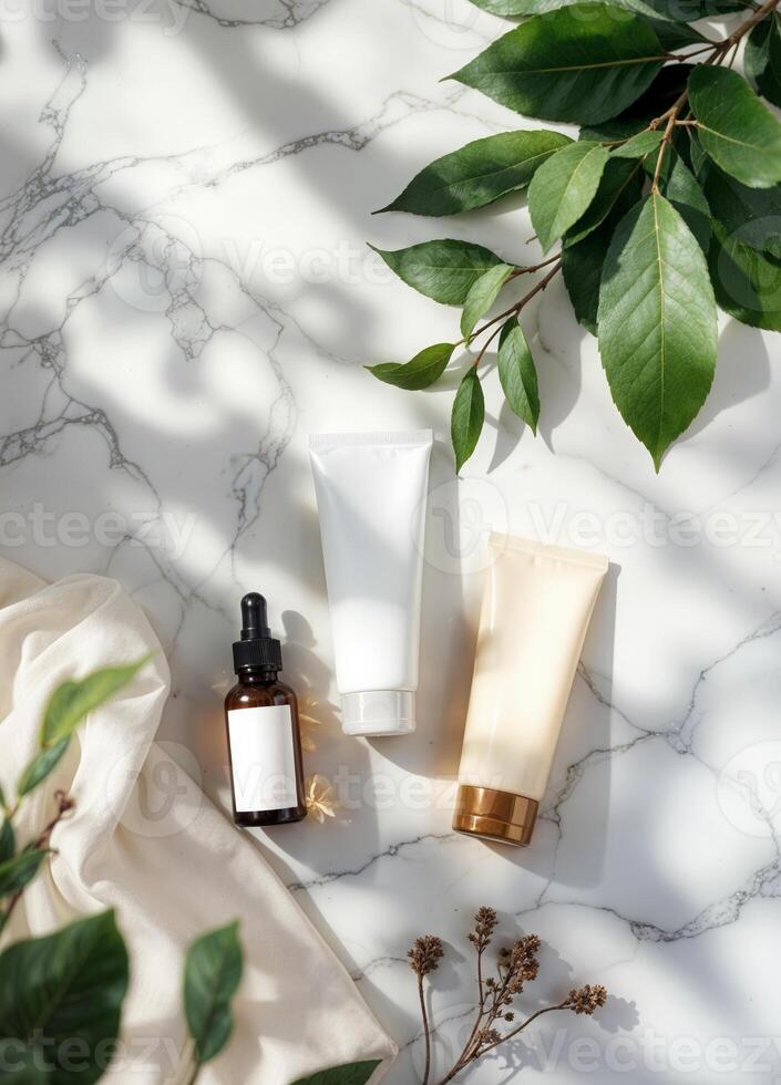 beauty products on marble surface with green leaves and cloth. Natural Skincare Products photo