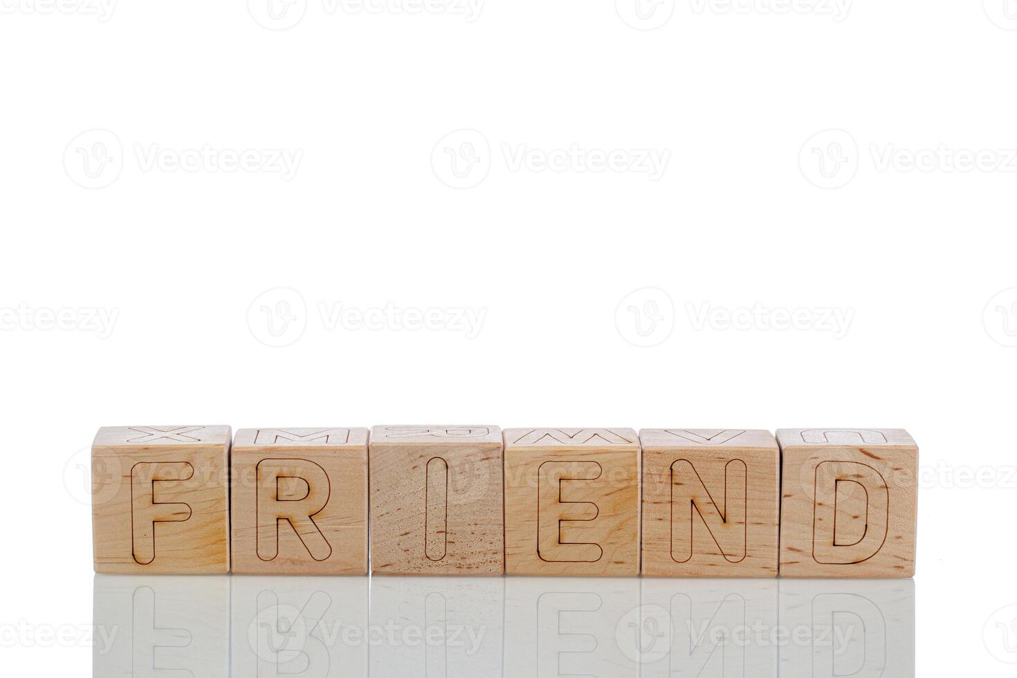 Wooden cubes with letters friend on a white background photo