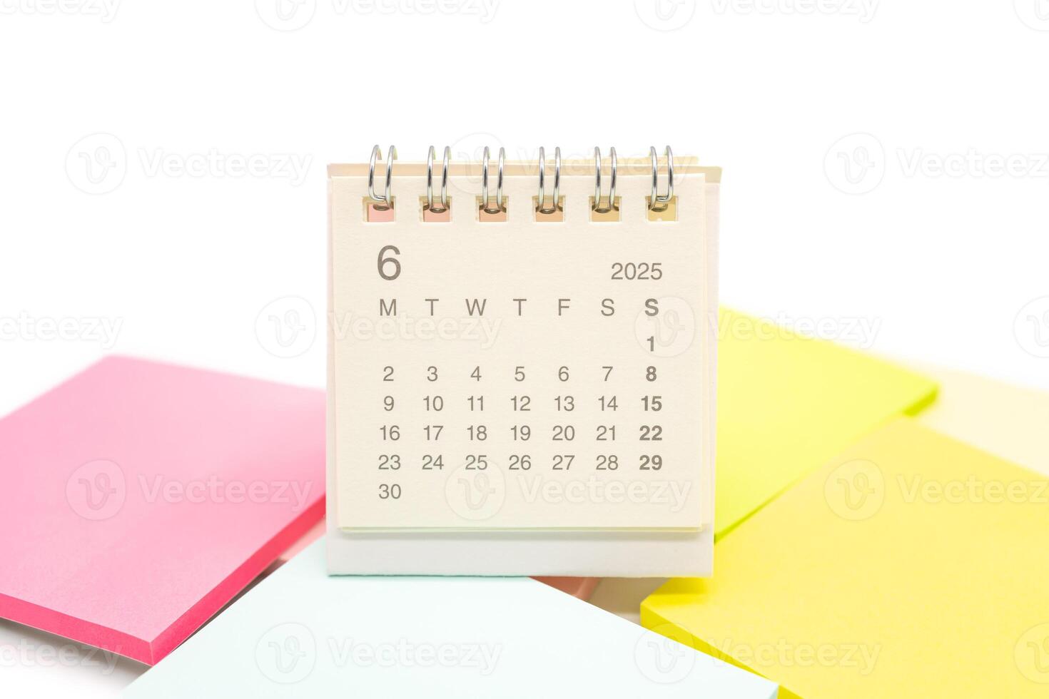 Mini Desk Calendar for JUNE 2025 background. Calendar concept with 2025 JUN calendar. Sticky note. isolated on white background. photo
