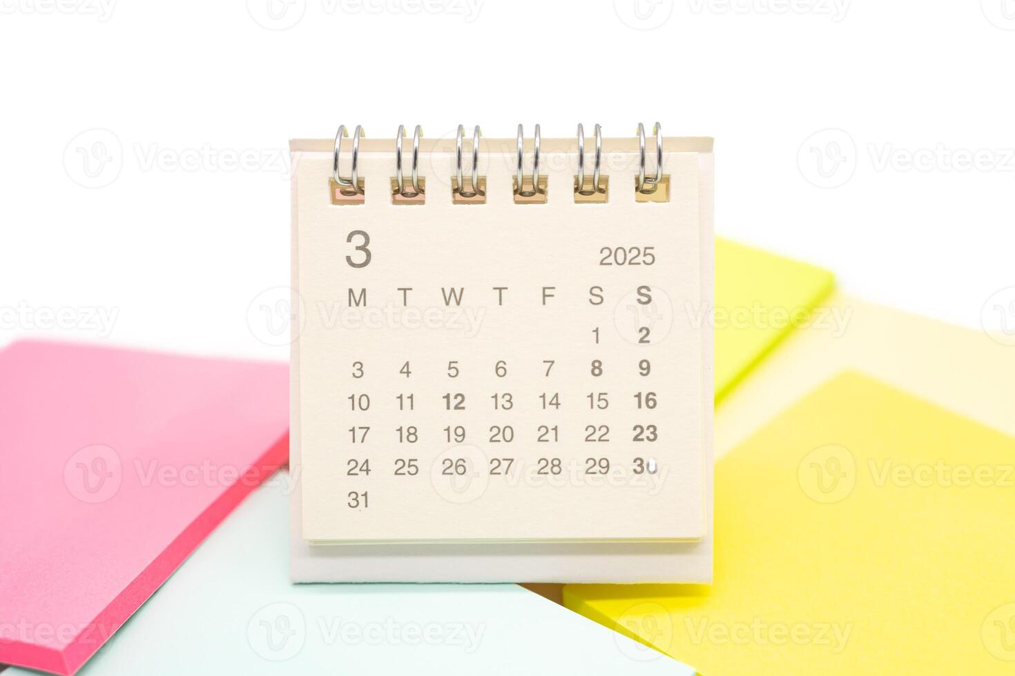 Mini Desk Calendar for MARCH 2025 background. Calendar concept with 2025 MAR calendar. Sticky note. isolated on white background. photo